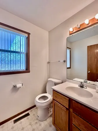 a bathroom with a glass shower door