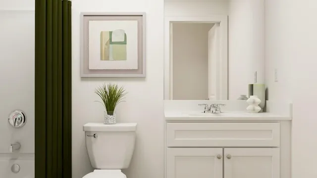 a bathroom with a sink toilet and a mirror