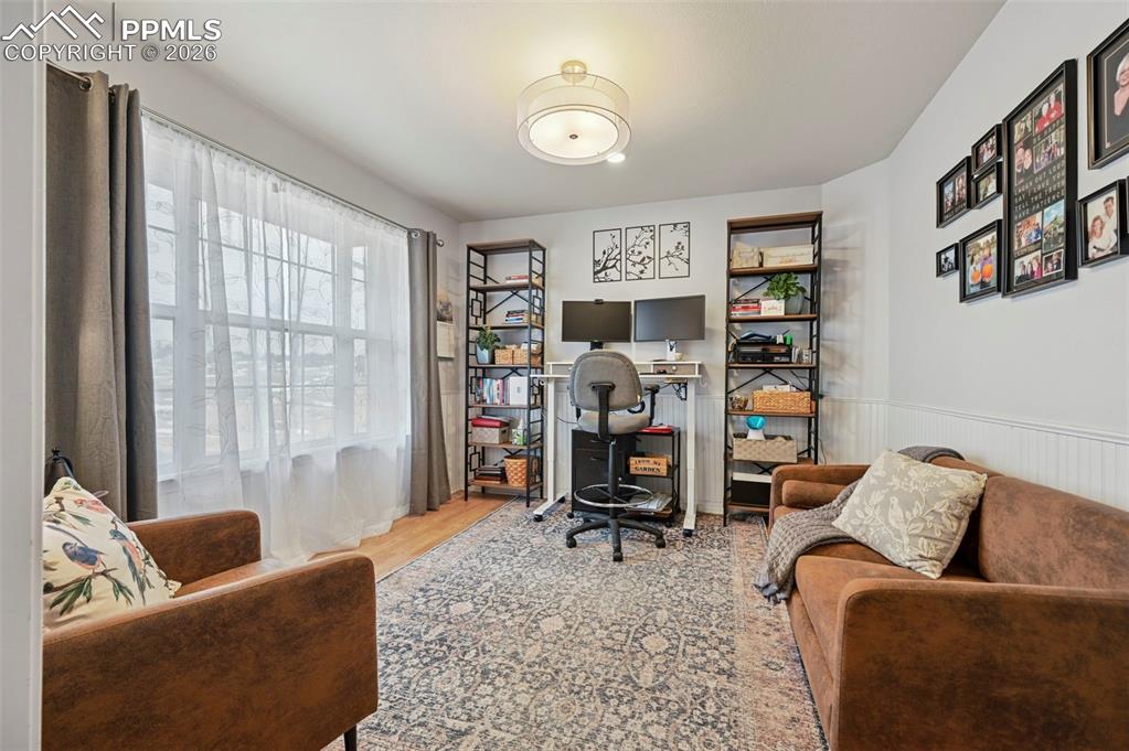 3430 Double Tree Court Colorado Springs, CO 80921 - Photo 12 of 50 a living room with furniture and a flat screen tv
