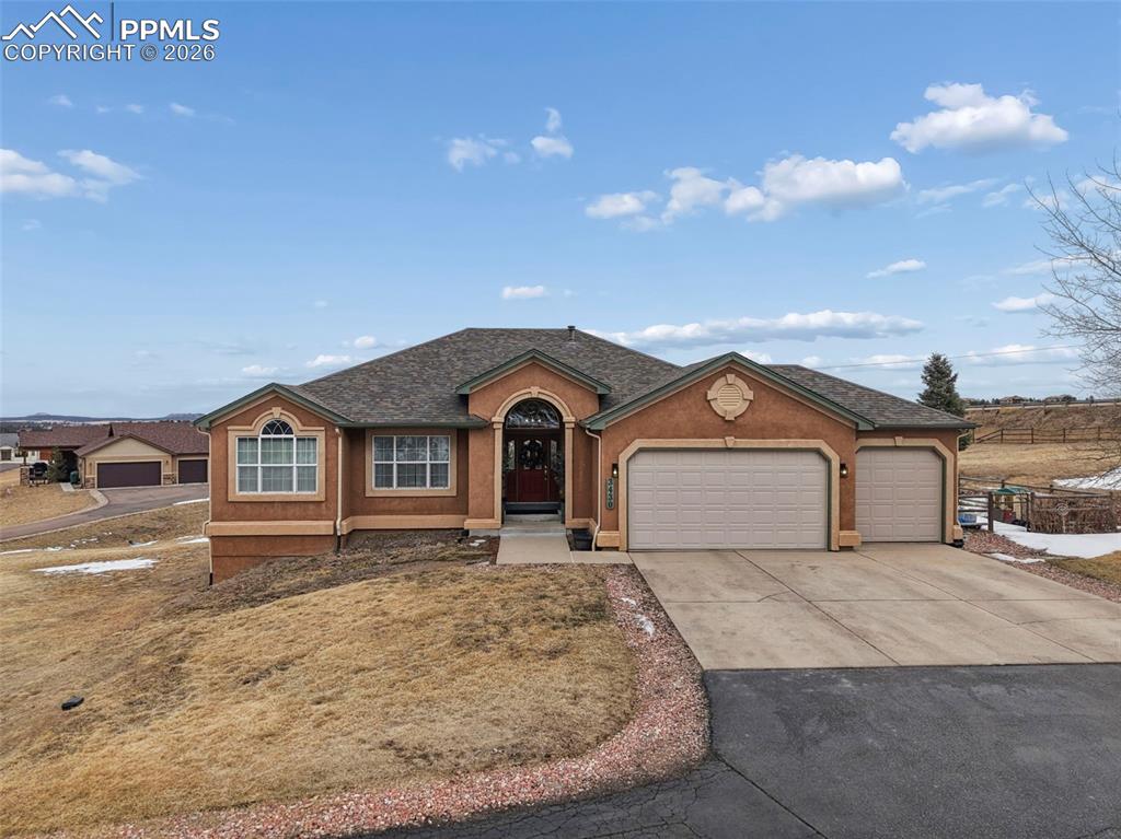 3430 Double Tree Court Colorado Springs, CO 80921 - Photo 2 of 50 a view of a house with a yard