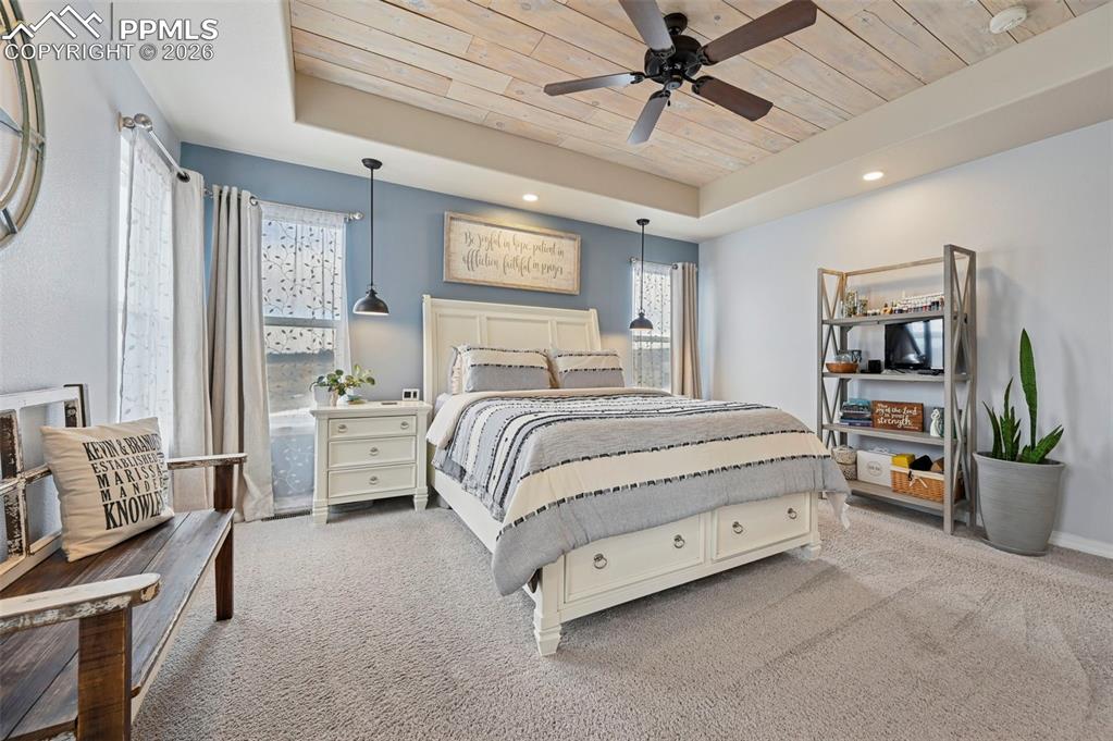 3430 Double Tree Court Colorado Springs, CO 80921 - Photo 30 of 50 a bedroom with a bed furniture and a large window