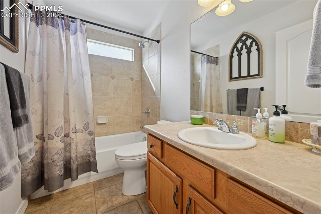 3430 Double Tree Court Colorado Springs, CO 80921 - Photo 33 of 50 a bathroom with a sink a toilet a mirror a vanity and shower