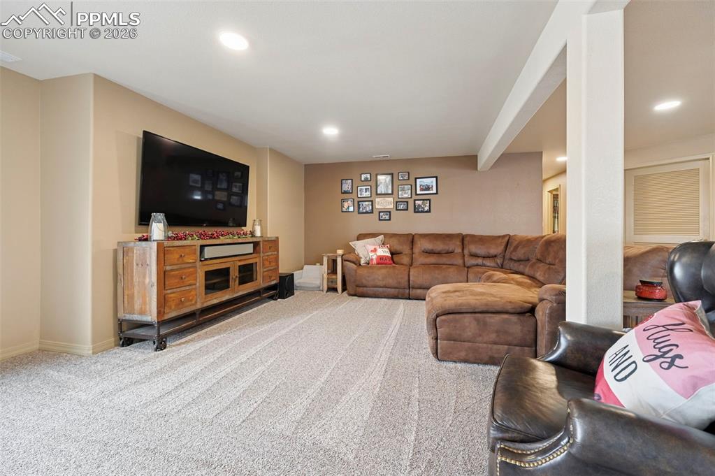 3430 Double Tree Court Colorado Springs, CO 80921 - Photo 37 of 50 a living room with furniture and a flat screen tv