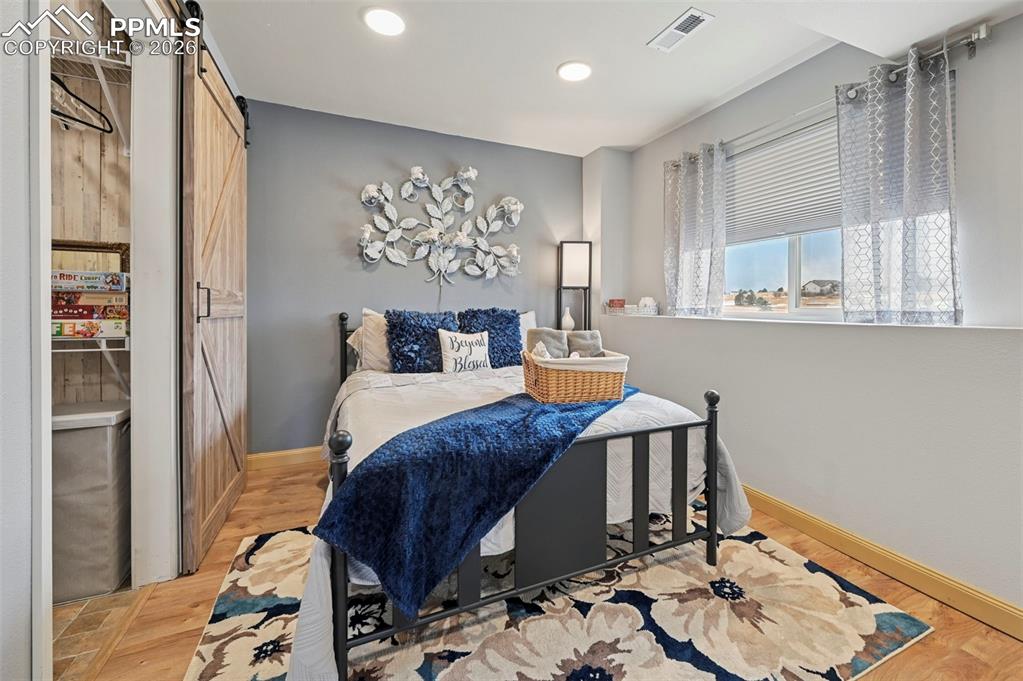 3430 Double Tree Court Colorado Springs, CO 80921 - Photo 39 of 50 a bed room with a bed and a window