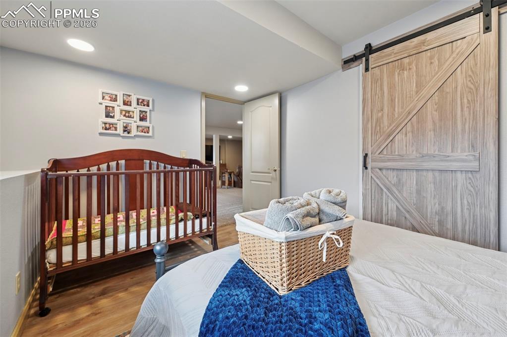 3430 Double Tree Court Colorado Springs, CO 80921 - Photo 40 of 50 a bedroom with furniture and a window