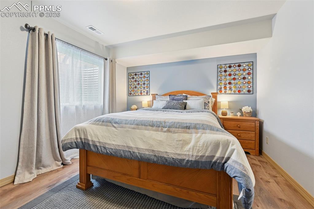 3430 Double Tree Court Colorado Springs, CO 80921 - Photo 41 of 50 a bed sitting in a bedroom next to a window