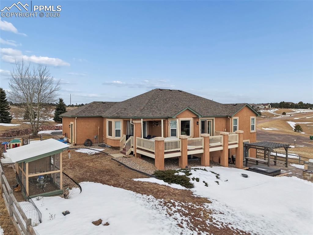 3430 Double Tree Court Colorado Springs, CO 80921 - Photo 7 of 50 a view of a house with a wooden bench next to a road