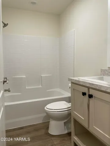 a bathroom with a sink a toilet and a bathtub