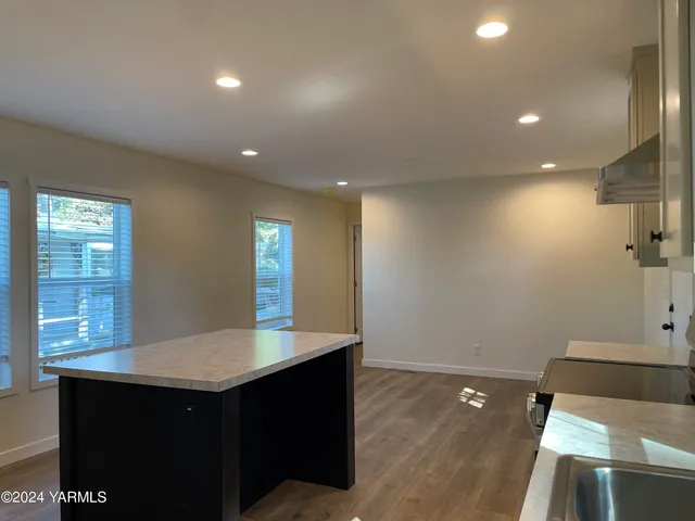 a kitchen with sink and window