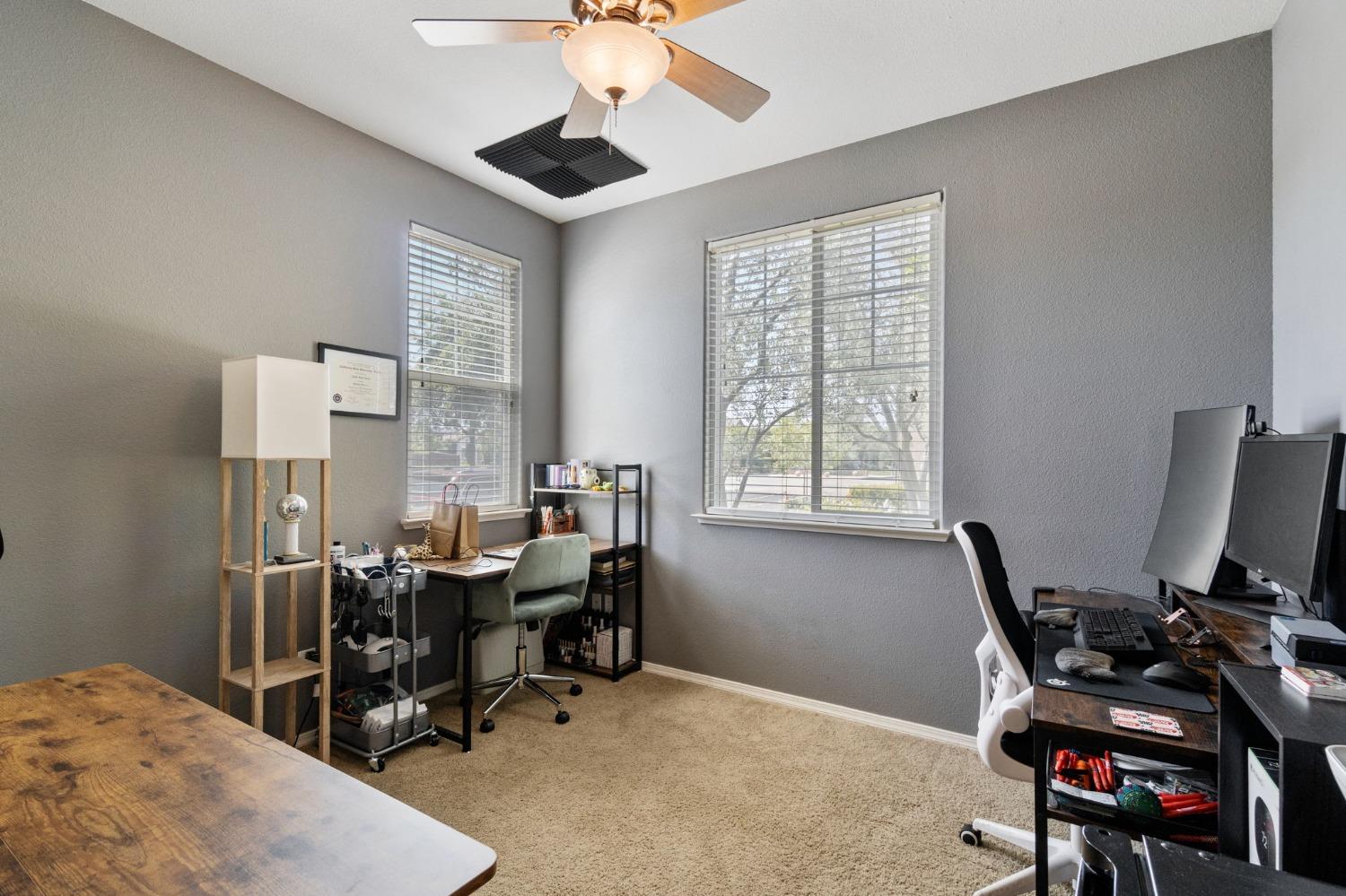 3915 Harlan Ranch Boulevard Clovis, CA 93619 - Photo 14 of 27 a view of a workspace with furniture and a window