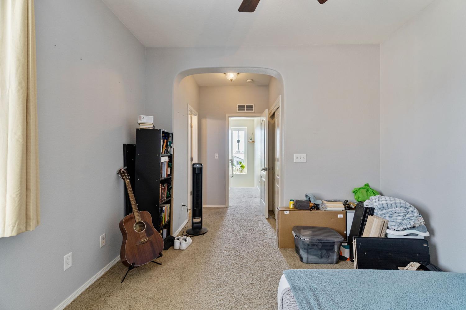 3915 Harlan Ranch Boulevard Clovis, CA 93619 - Photo 17 of 27 a view of a livingroom with furniture and windows