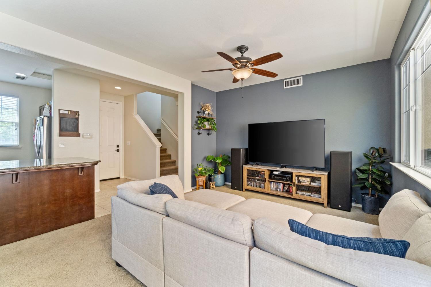 3915 Harlan Ranch Boulevard Clovis, CA 93619 - Photo 5 of 27 a living room with furniture and a flat screen tv