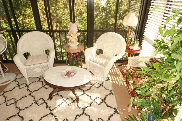 a view of a couches and table in the patio