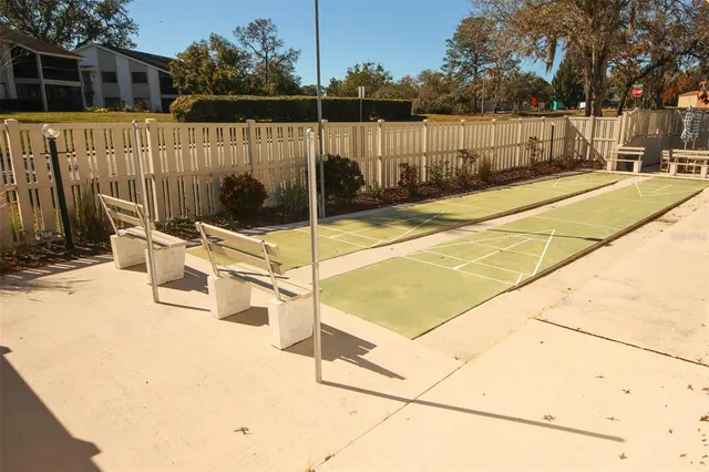 a view of a patio with a table and chairs