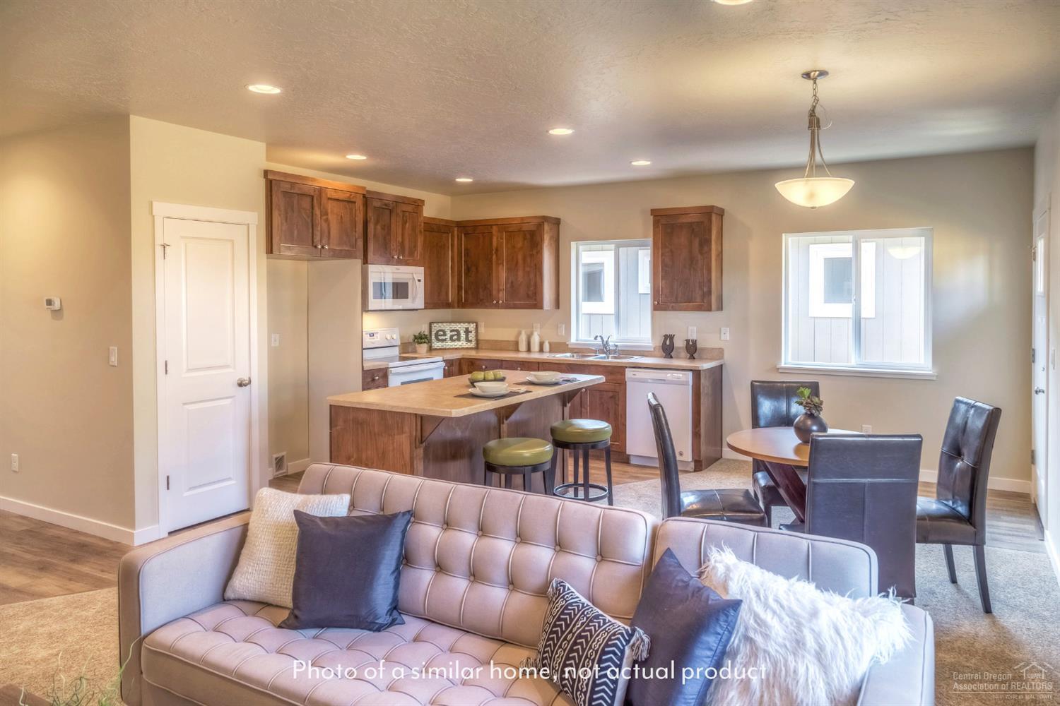 2547 Northeast Apollo Road Prineville, OR 97754 - Photo 1 of 9 a living room with furniture and a large window