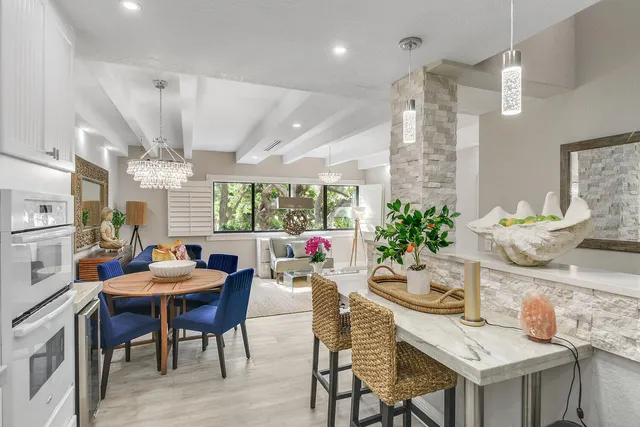 a dining room with furniture and window