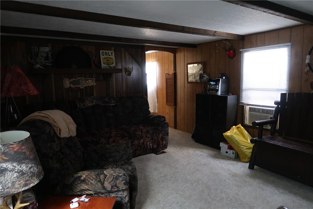 117 Esposito Road Mercer, PA 16137 - Photo 11 of 32 a living room with furniture and a flat screen tv