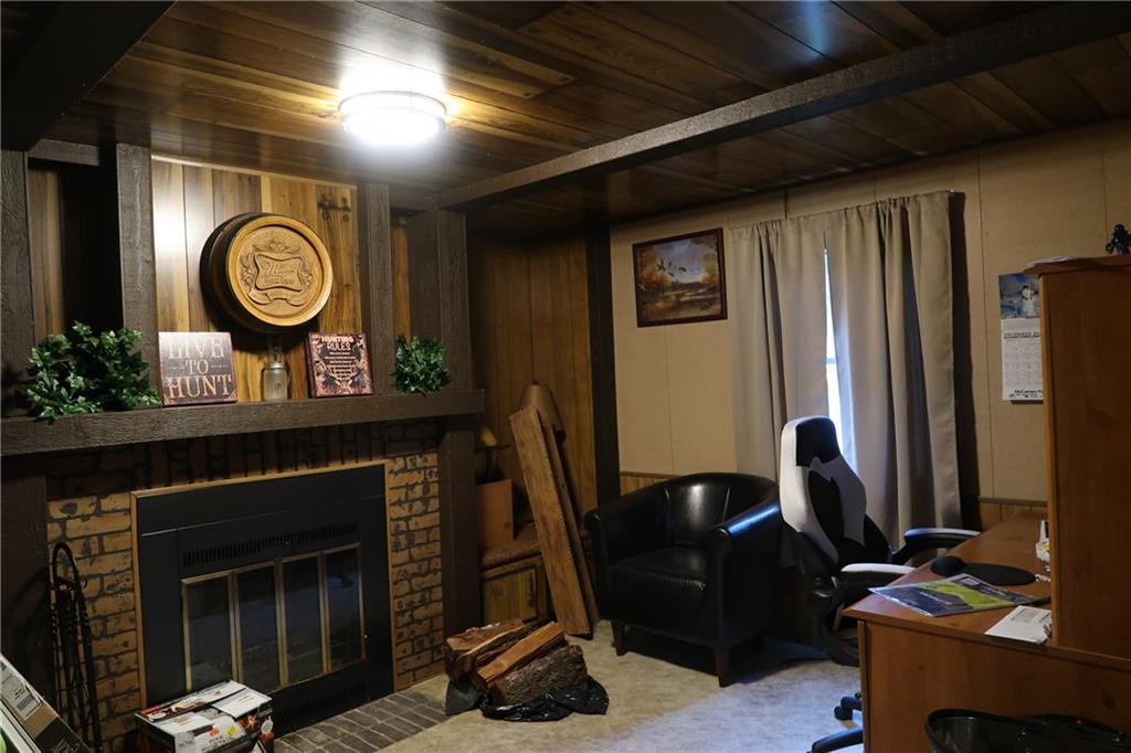 117 Esposito Road Mercer, PA 16137 - Photo 14 of 32 a living room with furniture and a fireplace