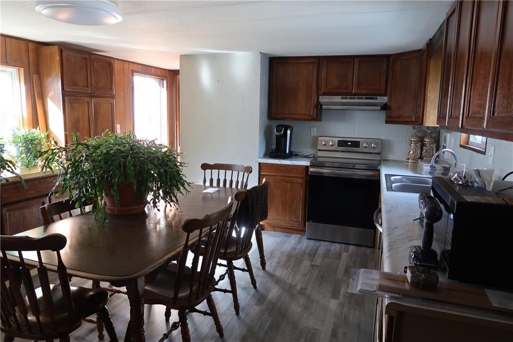 117 Esposito Road Mercer, PA 16137 - Photo 18 of 32 a kitchen with a table chairs stove and cabinets