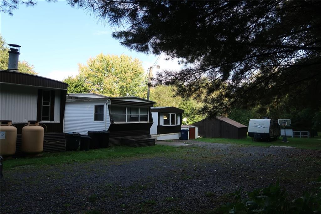 117 Esposito Road Mercer, PA 16137 - Photo 29 of 32 a view of a backyard with large trees