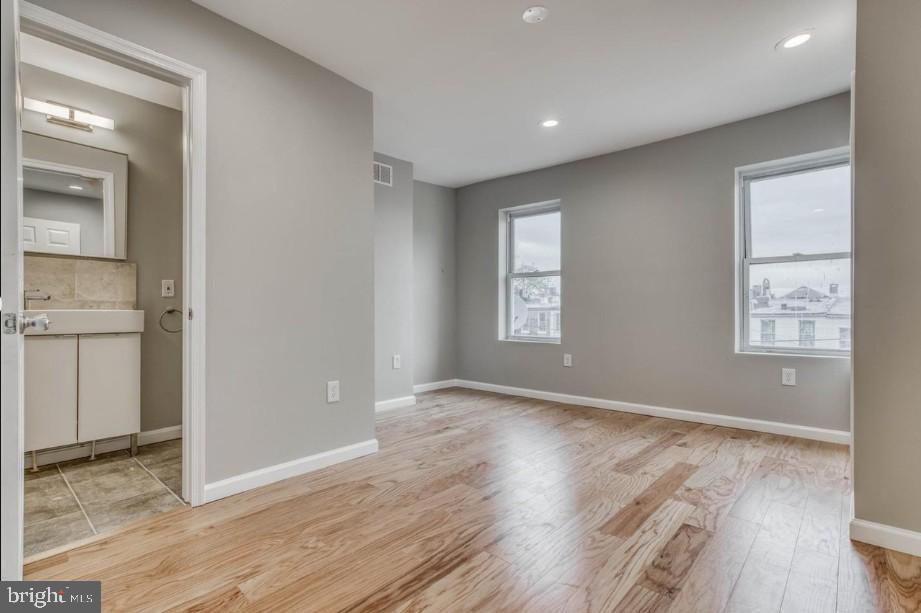 2409 Barclay Street Baltimore, MD 21218 - Photo 17 of 23 Bright and airy modern living space.