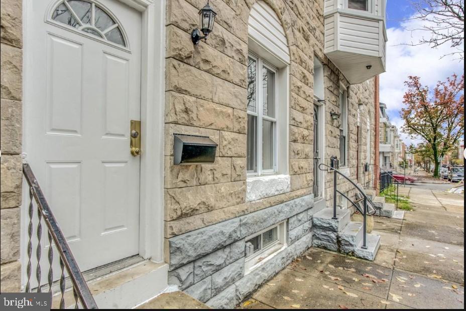 2409 Barclay Street Baltimore, MD 21218 - Photo 2 of 23 Charming entrance with classic stone facade.