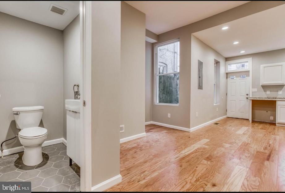 2409 Barclay Street Baltimore, MD 21218 - Photo 21 of 23 Modern space with natural light and style.