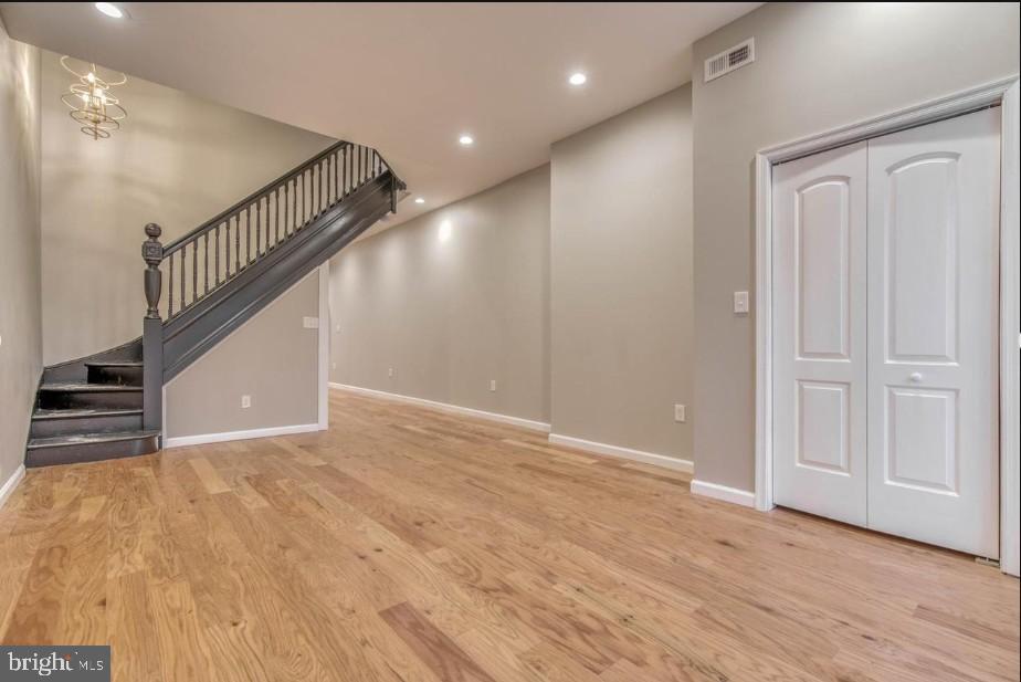 2409 Barclay Street Baltimore, MD 21218 - Photo 22 of 23 Inviting entryway with elegant staircase.