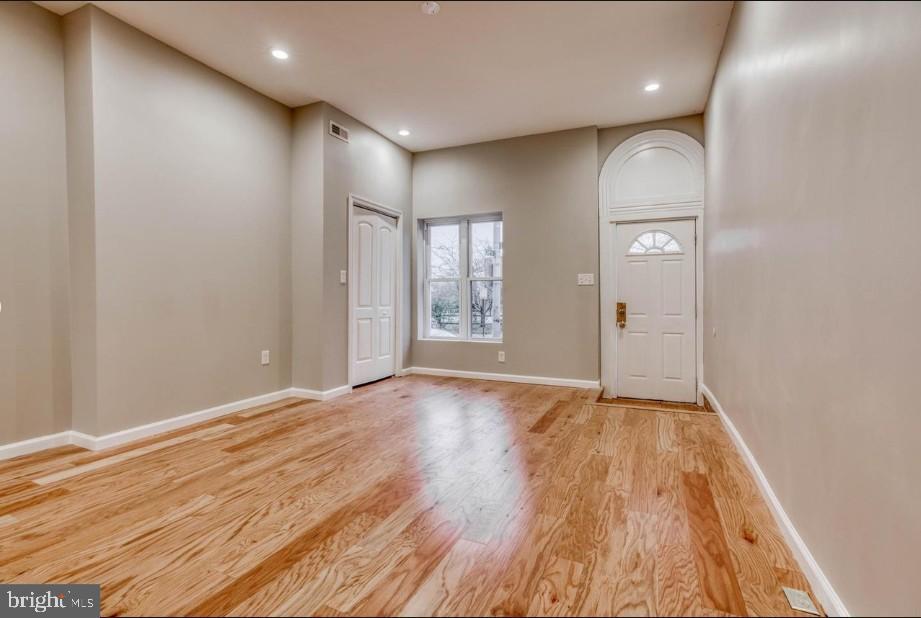 2409 Barclay Street Baltimore, MD 21218 - Photo 23 of 23 Bright and inviting entryway with hardwood floors.