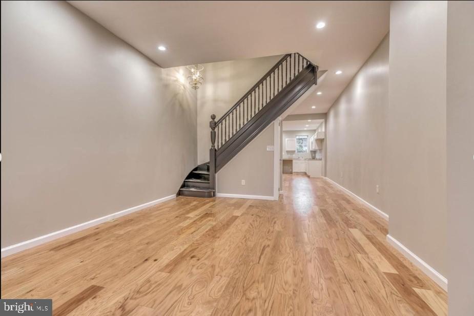 2409 Barclay Street Baltimore, MD 21218 - Photo 5 of 23 Spacious entryway with elegant staircase.