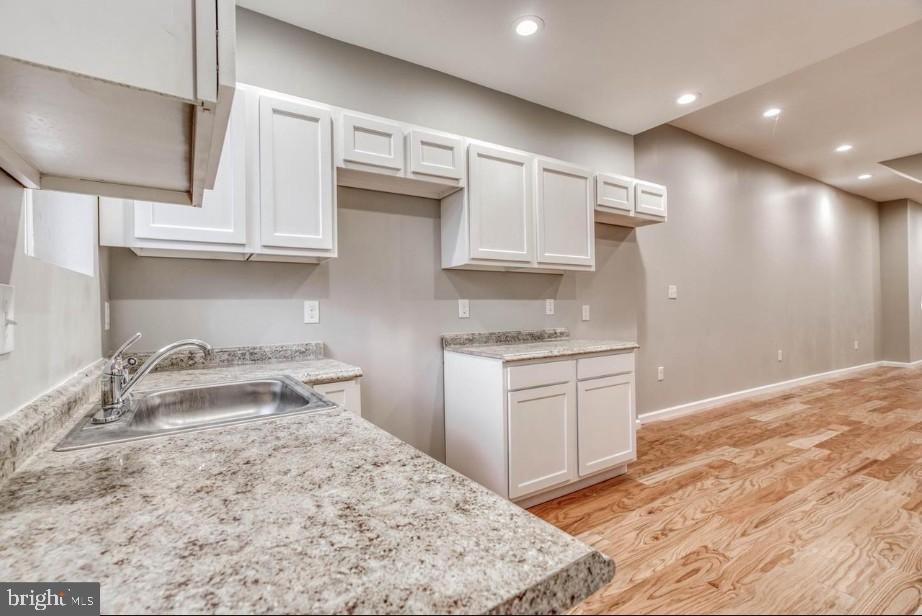 2409 Barclay Street Baltimore, MD 21218 - Photo 6 of 23 Modern kitchen with sleek finishes.