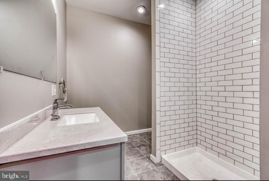 2409 Barclay Street Baltimore, MD 21218 - Photo 9 of 23 Sleek modern bathroom with elegant finishes.