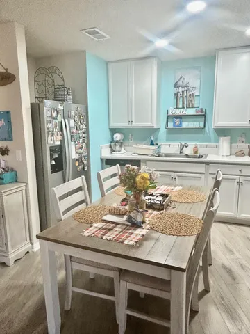 a view of a dining room with furniture