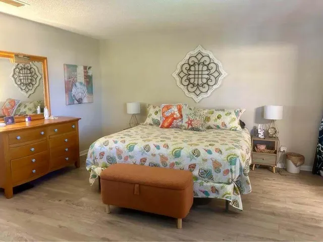 a bedroom with a bed and a cabinets