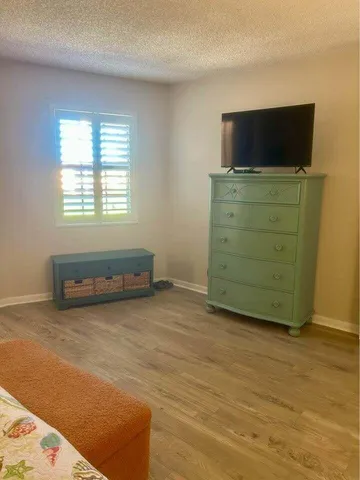 a room with furniture and flat screen tv