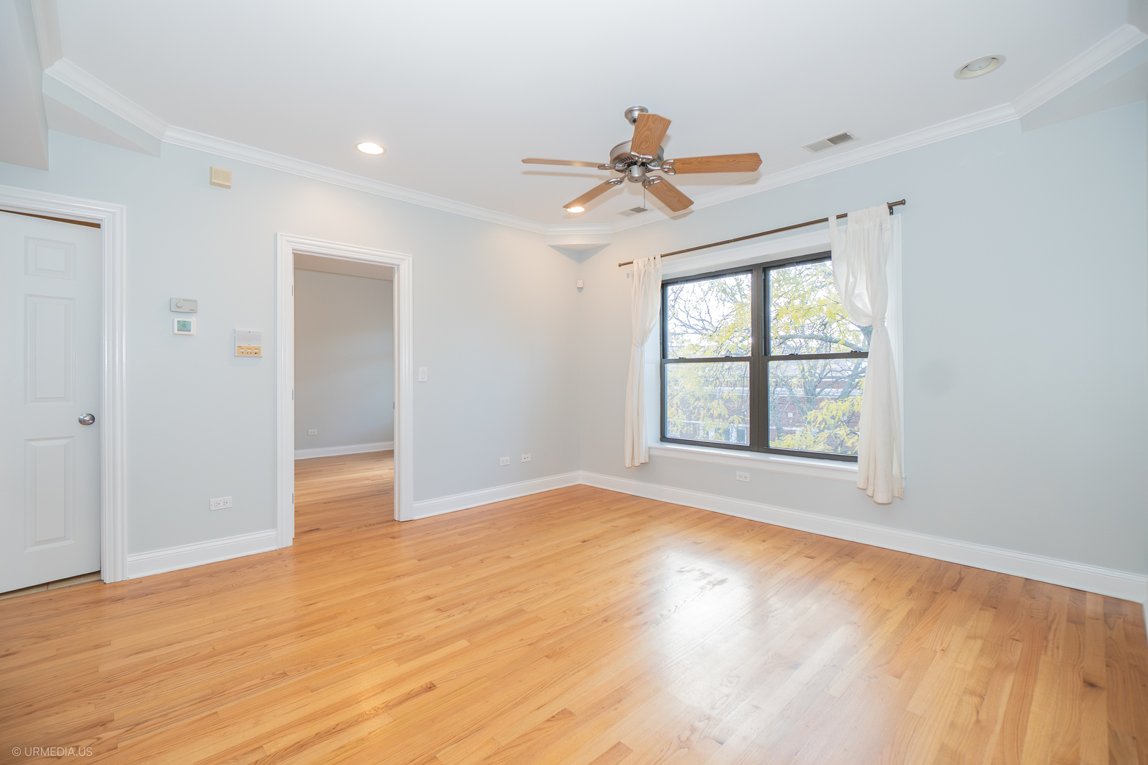 2608 West Leland Avenue, Unit 3 Chicago, IL 60625 - Photo 7 of 20 a view of an empty room with a window