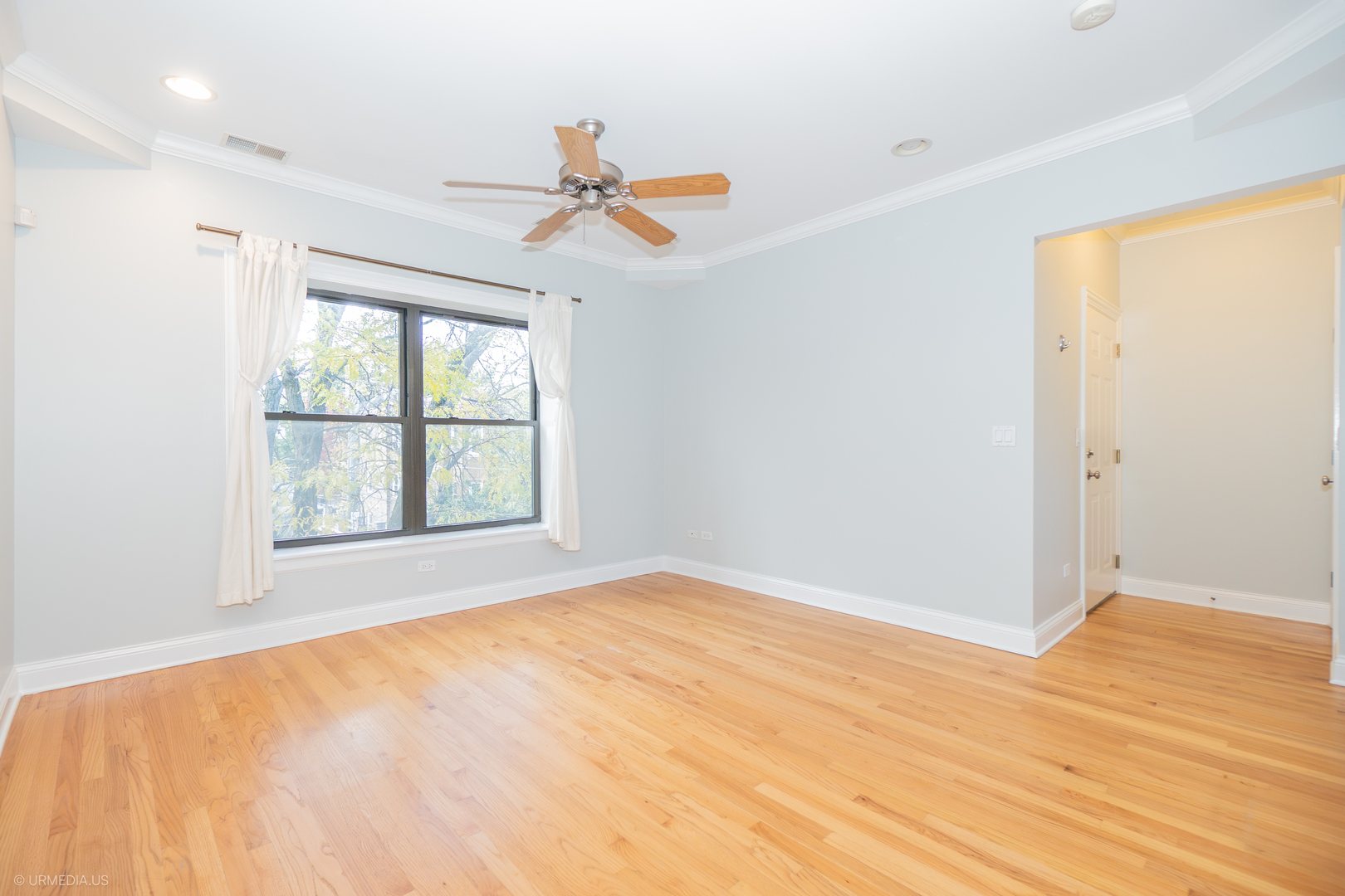 2608 West Leland Avenue, Unit 3 Chicago, IL 60625 - Photo 8 of 20 a view of an empty room with a window