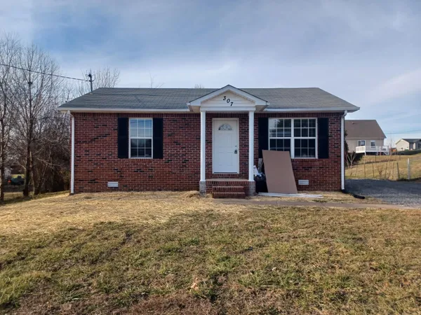 a house with yard in front of it