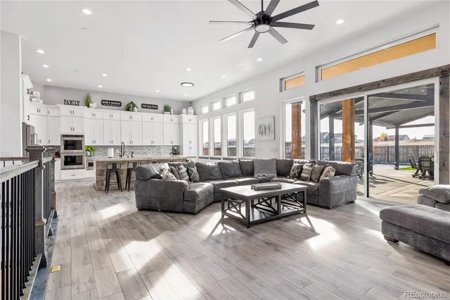 a living room with fireplace furniture and a flat screen tv
