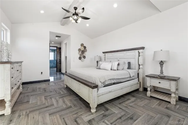 a spacious bathroom with a double vanity sink a mirror and a shower