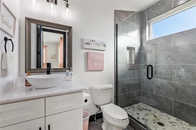 a spacious bathroom with a double vanity sink and a mirror
