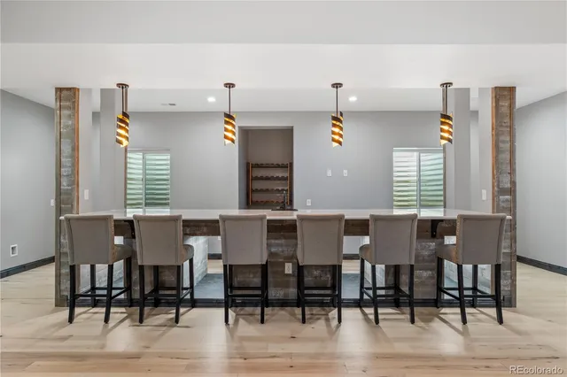 a large room with wooden floor and furniture