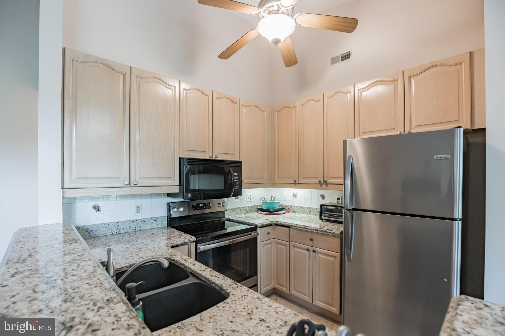 134 Square Rigger Way, Unit 134 Solomons, MD 20688 - Photo 12 of 32 Kitchen w/Granite Counters, new frig & stove