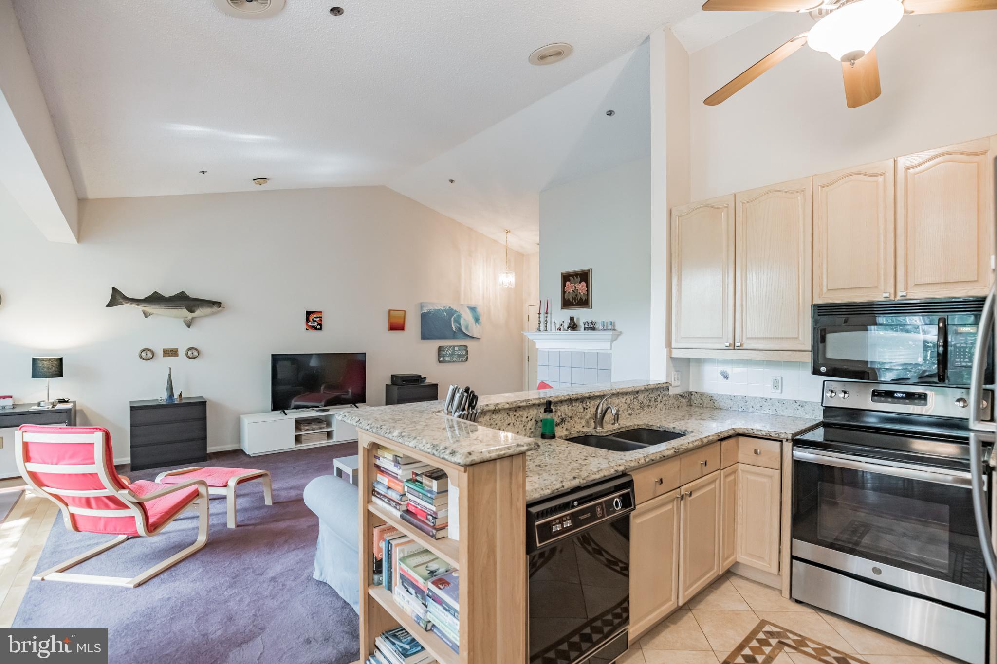 134 Square Rigger Way, Unit 134 Solomons, MD 20688 - Photo 13 of 32 Kitchen overlooks Living Room & Dining Room