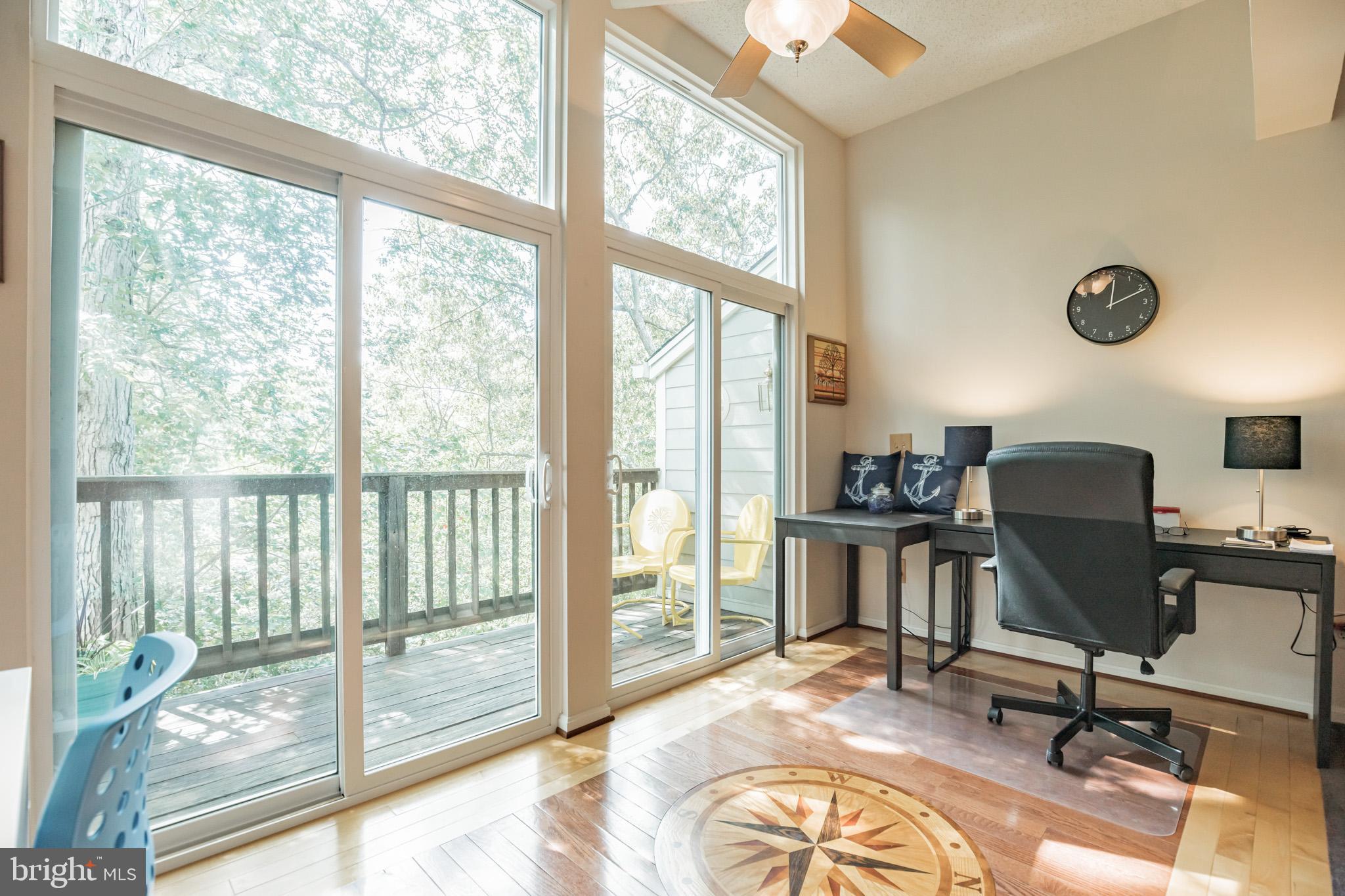 134 Square Rigger Way, Unit 134 Solomons, MD 20688 - Photo 6 of 32 Living Room Nook -Nautical HW floors