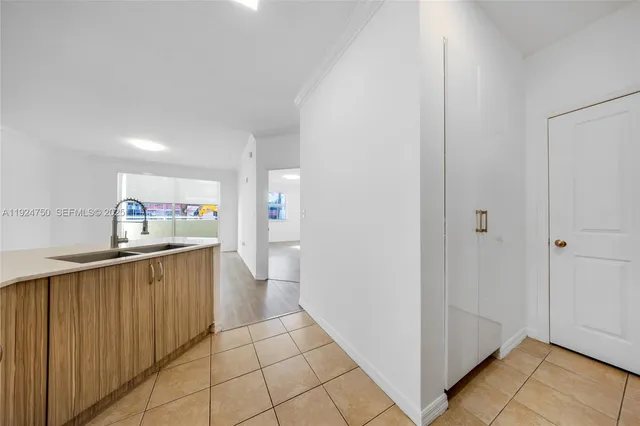 a kitchen with stainless steel appliances a refrigerator and a sink