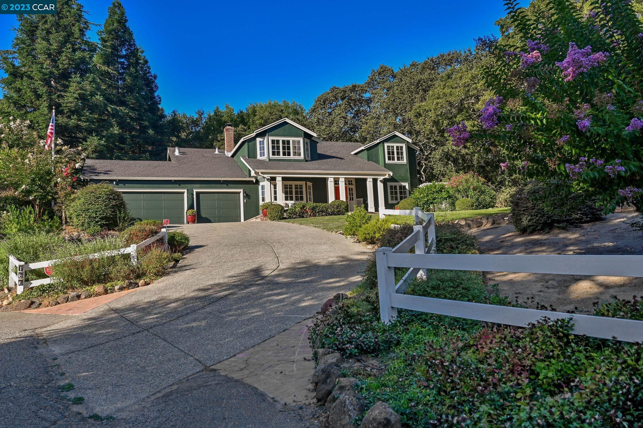 166 Gerald Drive Danville, CA 94526 - Photo 1 of 1 a front view of a house with a garden
