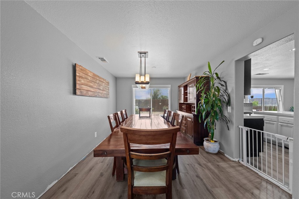 29266 Granite Ridge Court Menifee, CA 92587 - Photo 11 of 51 a dining room with furniture and window