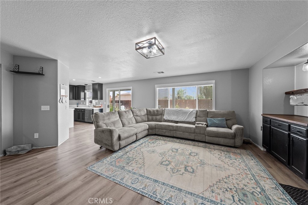 29266 Granite Ridge Court Menifee, CA 92587 - Photo 20 of 51 a living room with furniture wooden floor and a window
