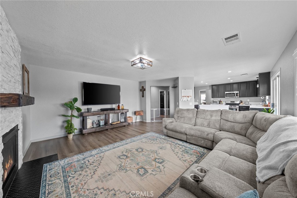 29266 Granite Ridge Court Menifee, CA 92587 - Photo 22 of 51 a living room with furniture and a flat screen tv